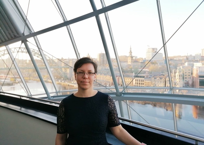 Yulia Dzenkovska, founder of the Service Design North Ltd, standing at Sage with Newcastle upon Tyne in the background